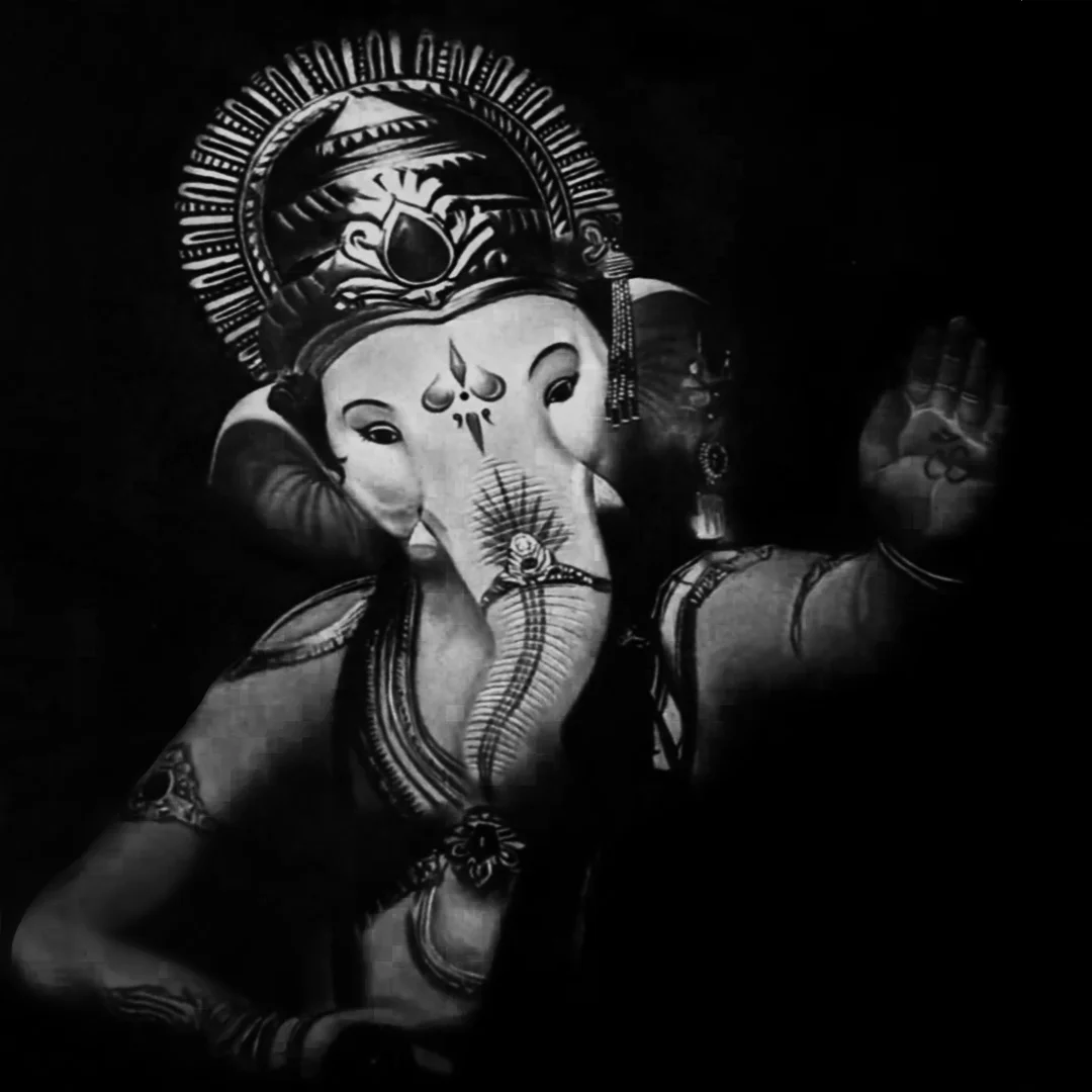 An Image of God Ganesh Ji showering blessings on everyone. The colour of the image is black and white.